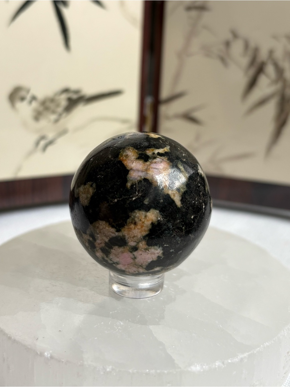 Pink thulite in black jade sphere